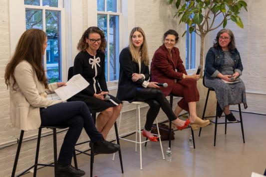 panel of women speaking at event